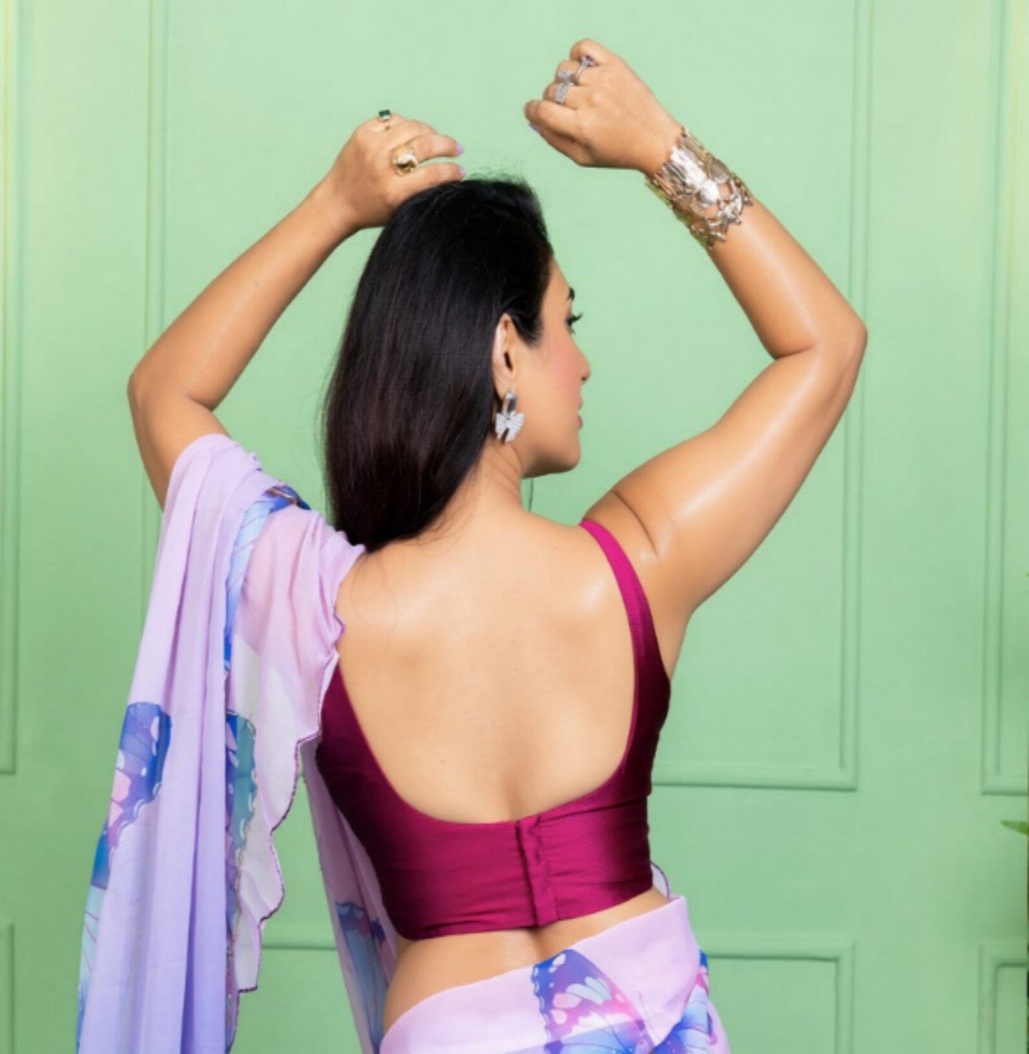 Our muse in a bollywood-style glamorous purple chiffon saree with butterfly katdana work with ready-to-wear Purple brocade blouse perfect for parties and dinner dates exclusively from Me My Muse by Lavitha