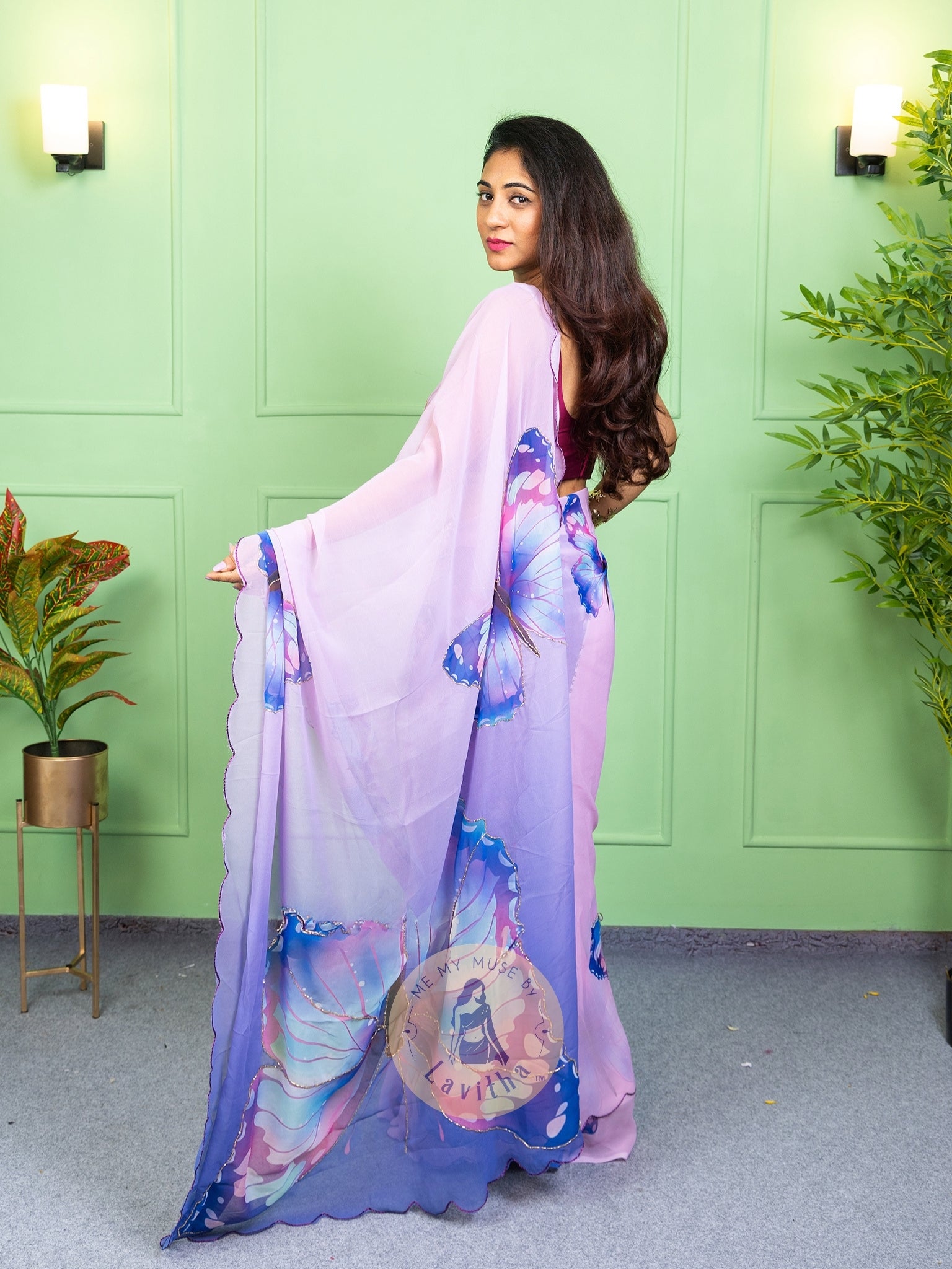 Our muse in a bollywood-style glamorous purple chiffon saree with butterfly katdana work with ready-to-wear Purple brocade blouse perfect for parties and dinner dates exclusively from Me My Muse by Lavitha