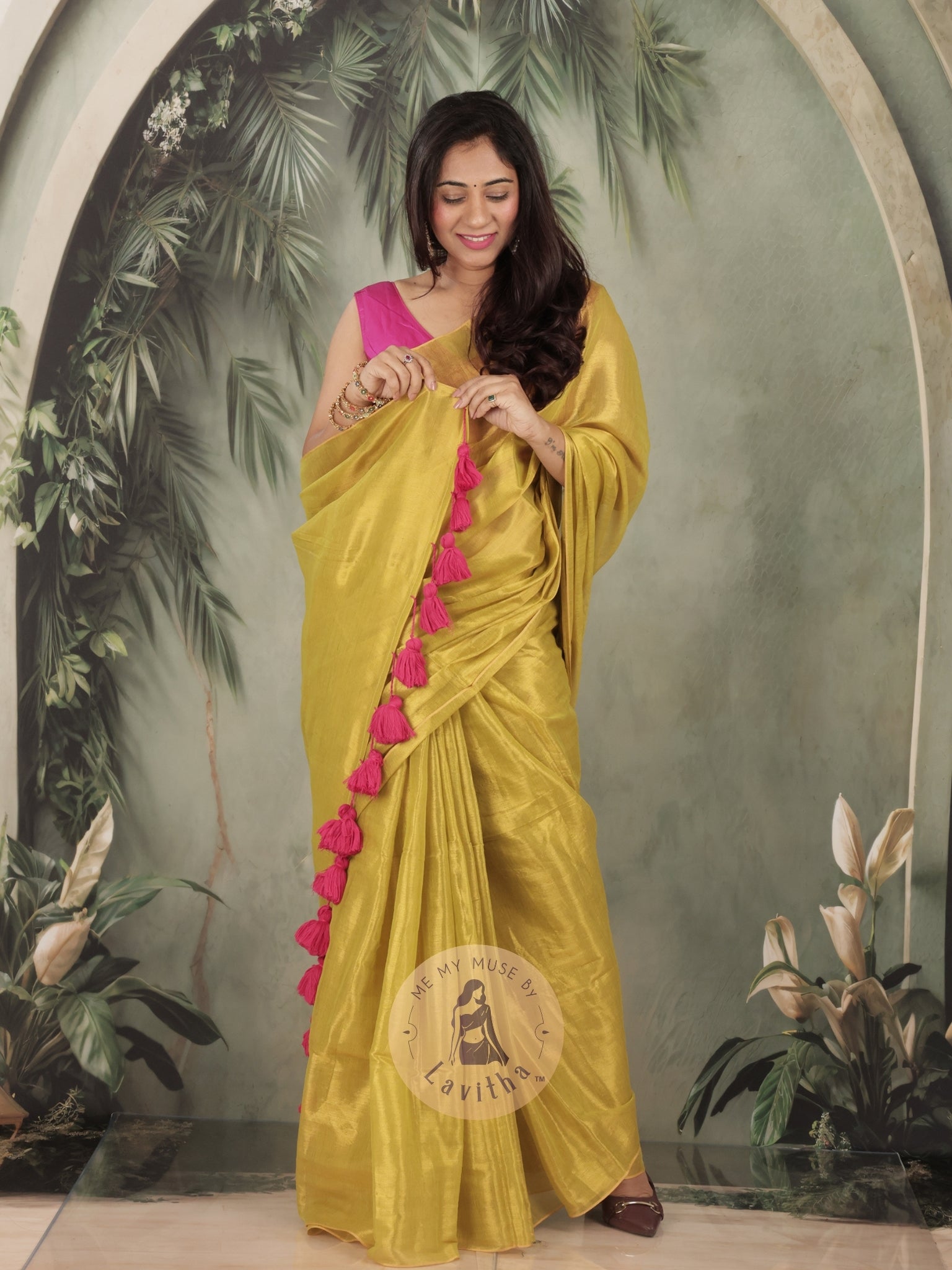 Bombshell Sunny Green Tissue Saree with Fuschia Pink Tassels