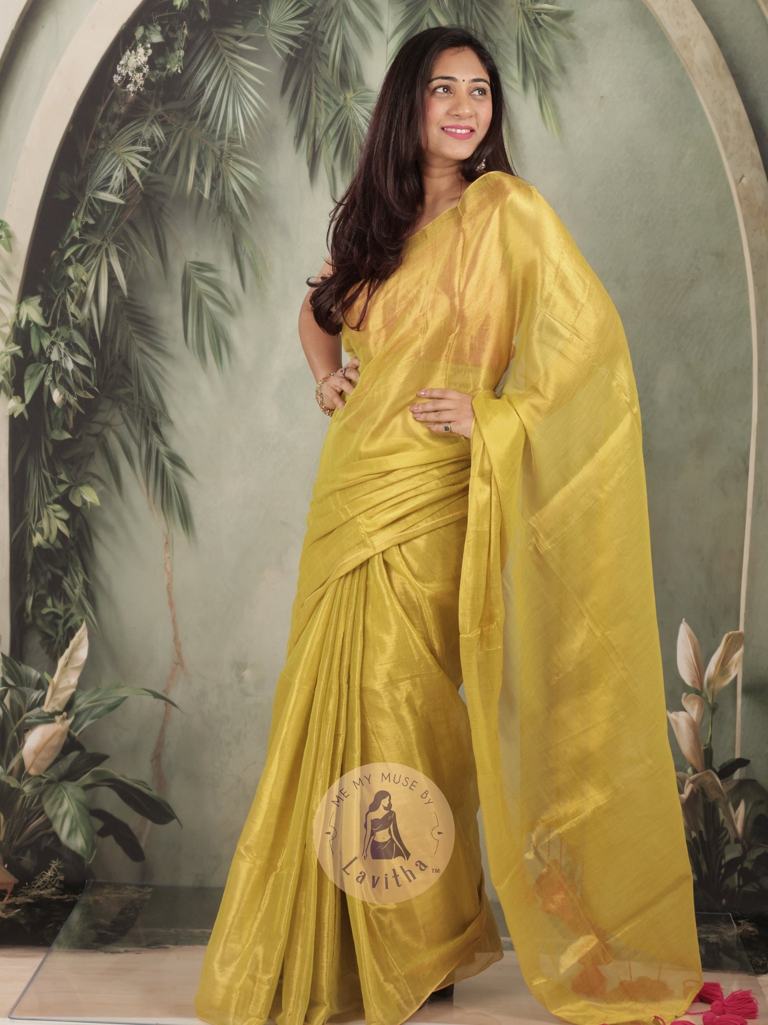 Bombshell Sunny Green Tissue Saree with Fuschia Pink Tassels