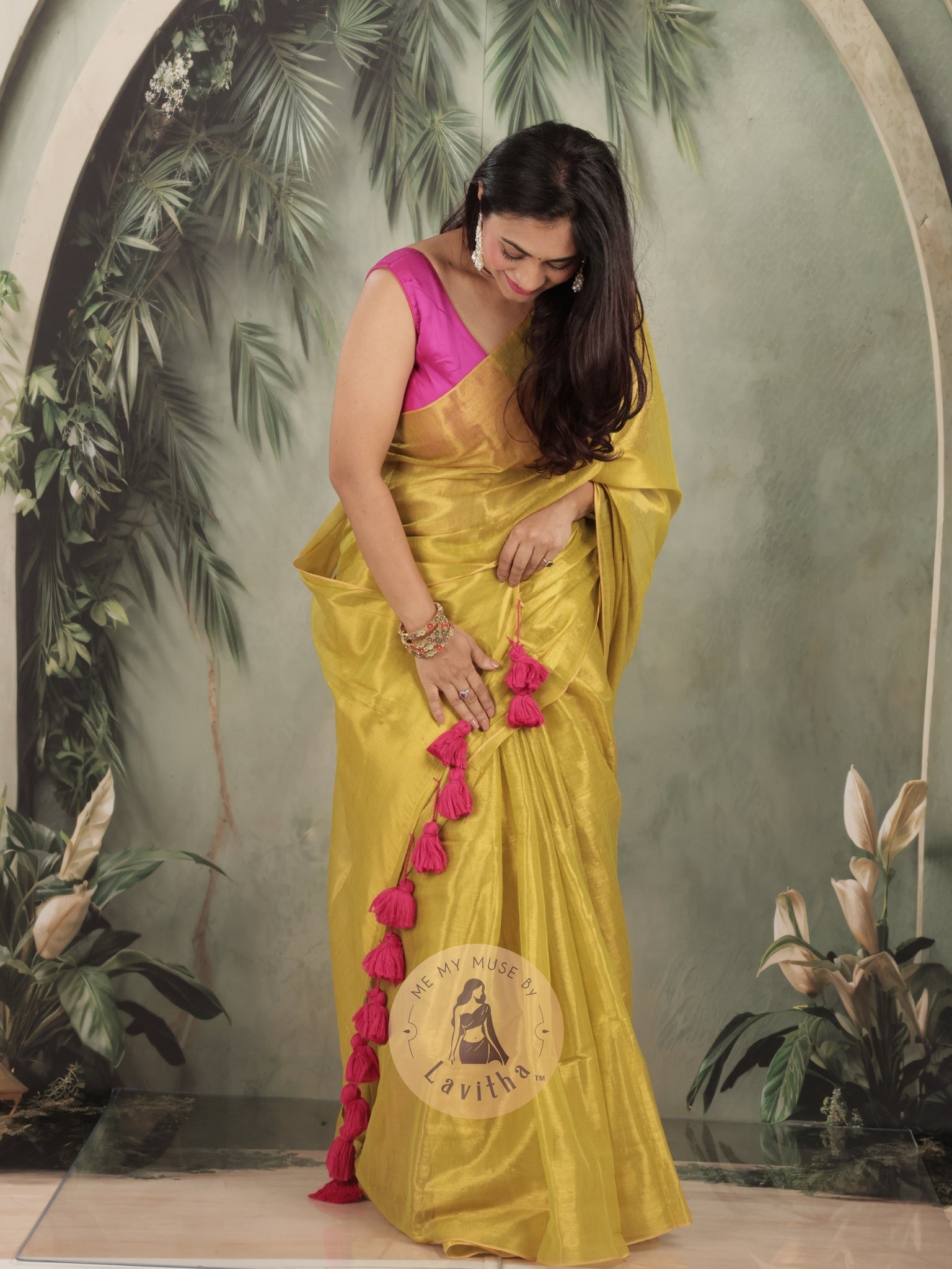 Bombshell Sunny Green Tissue Saree with Fuschia Pink Tassels