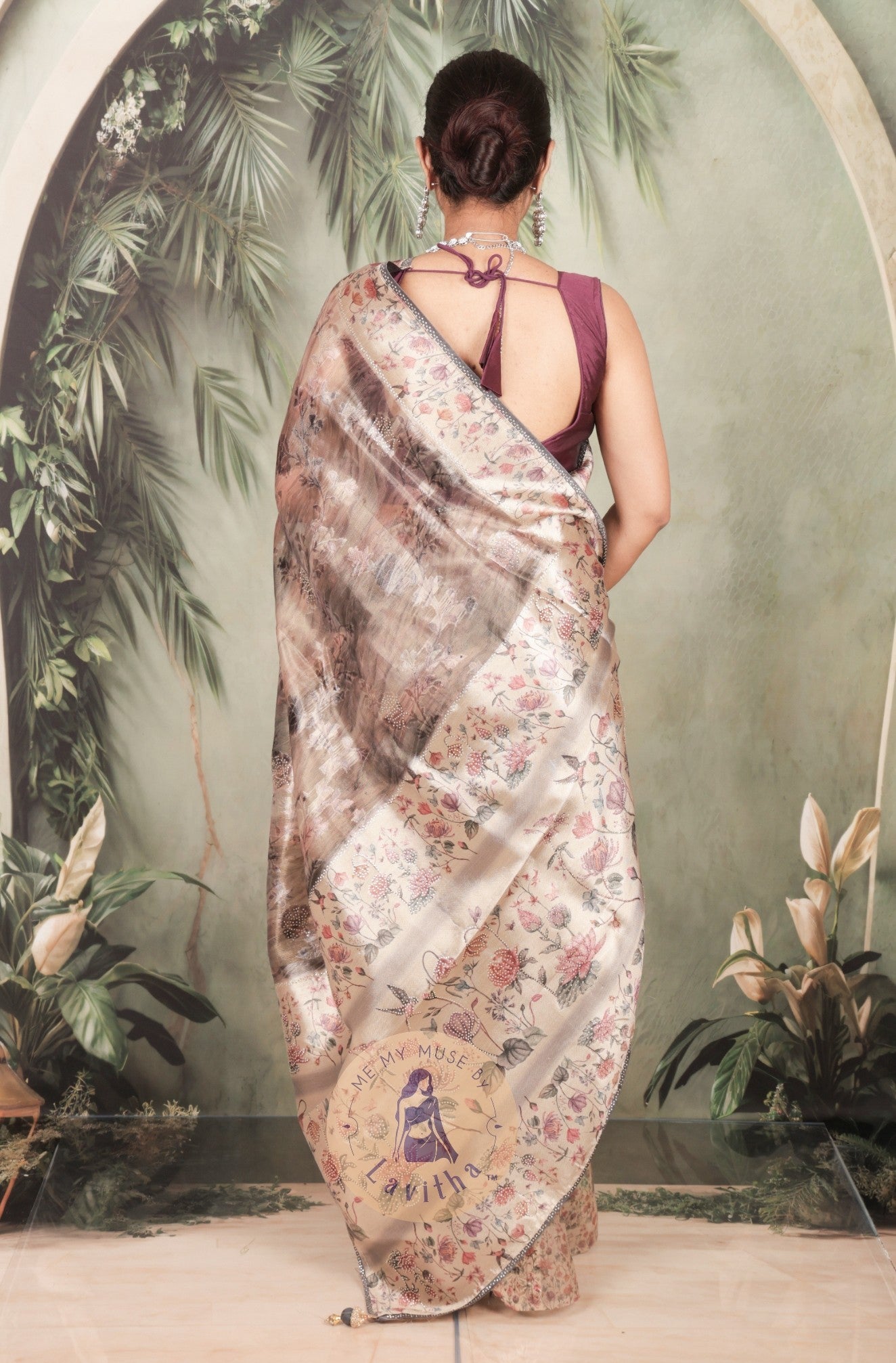 Our muse in a brown grey satin saree with digital floral print design and intricate floral design and crystal work on the border and pallu. This saree is part of the Dilqash collection from Me My Muse by Lavitha