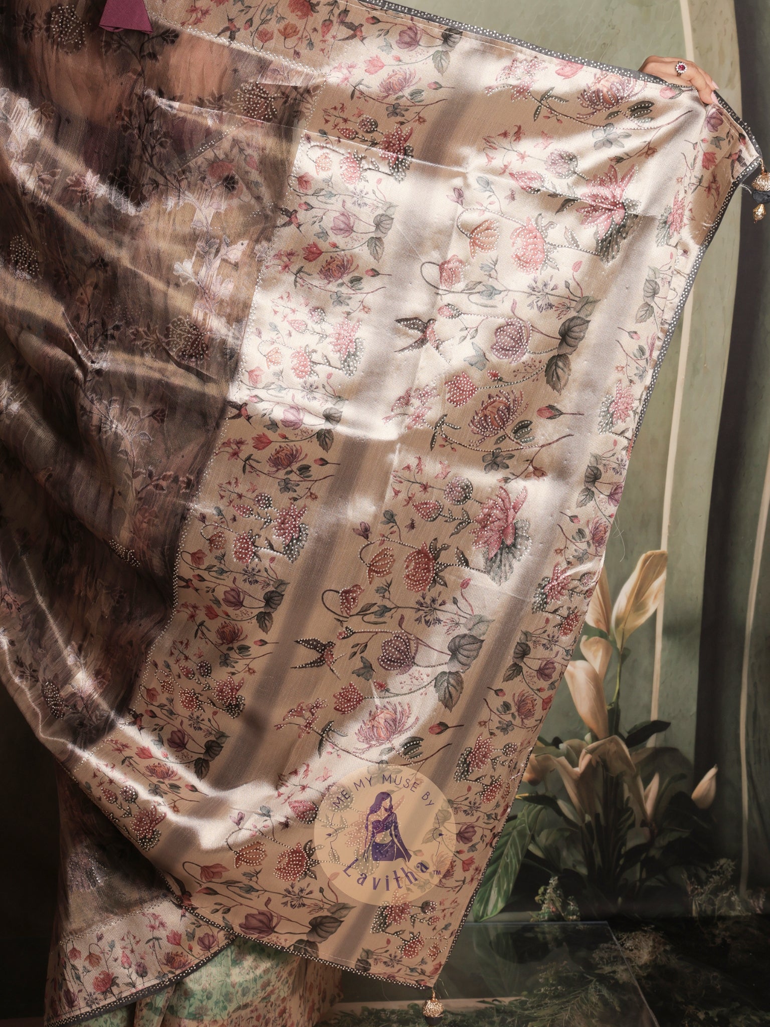 Our muse in a brown grey satin saree with digital floral print design and intricate floral design and crystal work on the border and pallu. This saree is part of the Dilqash collection from Me My Muse by Lavitha