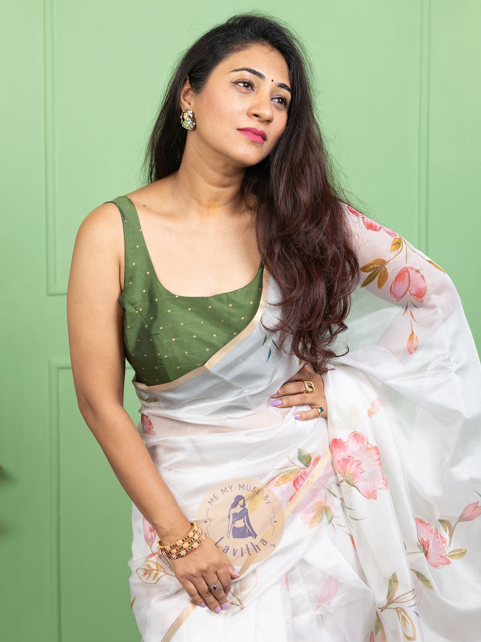 Our muse in a white organza printed saree with floral patterns and thin gold border from Me My Muse by Lavitha