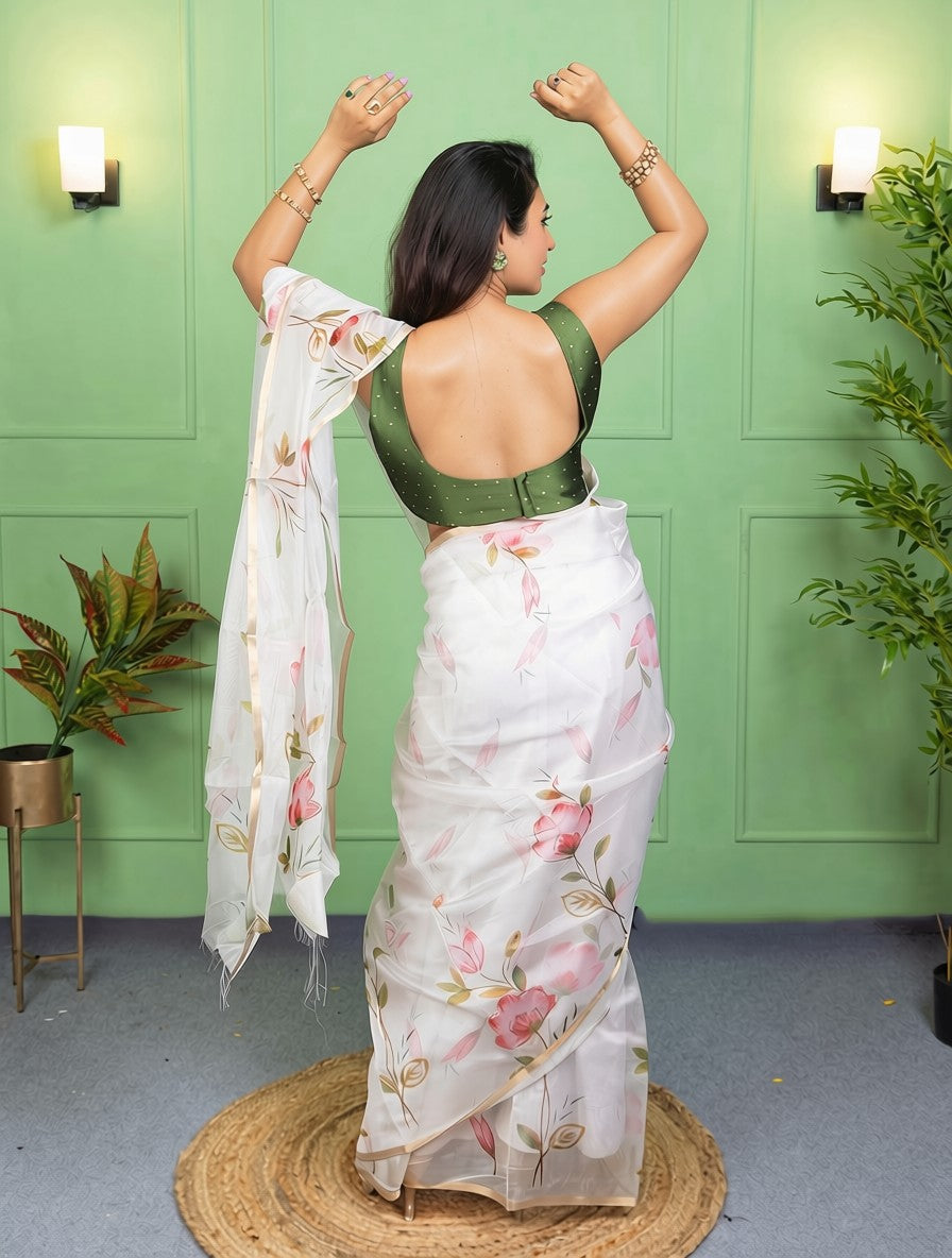 Our muse in a white organza printed saree with floral patterns and thin gold border from Me My Muse by Lavitha