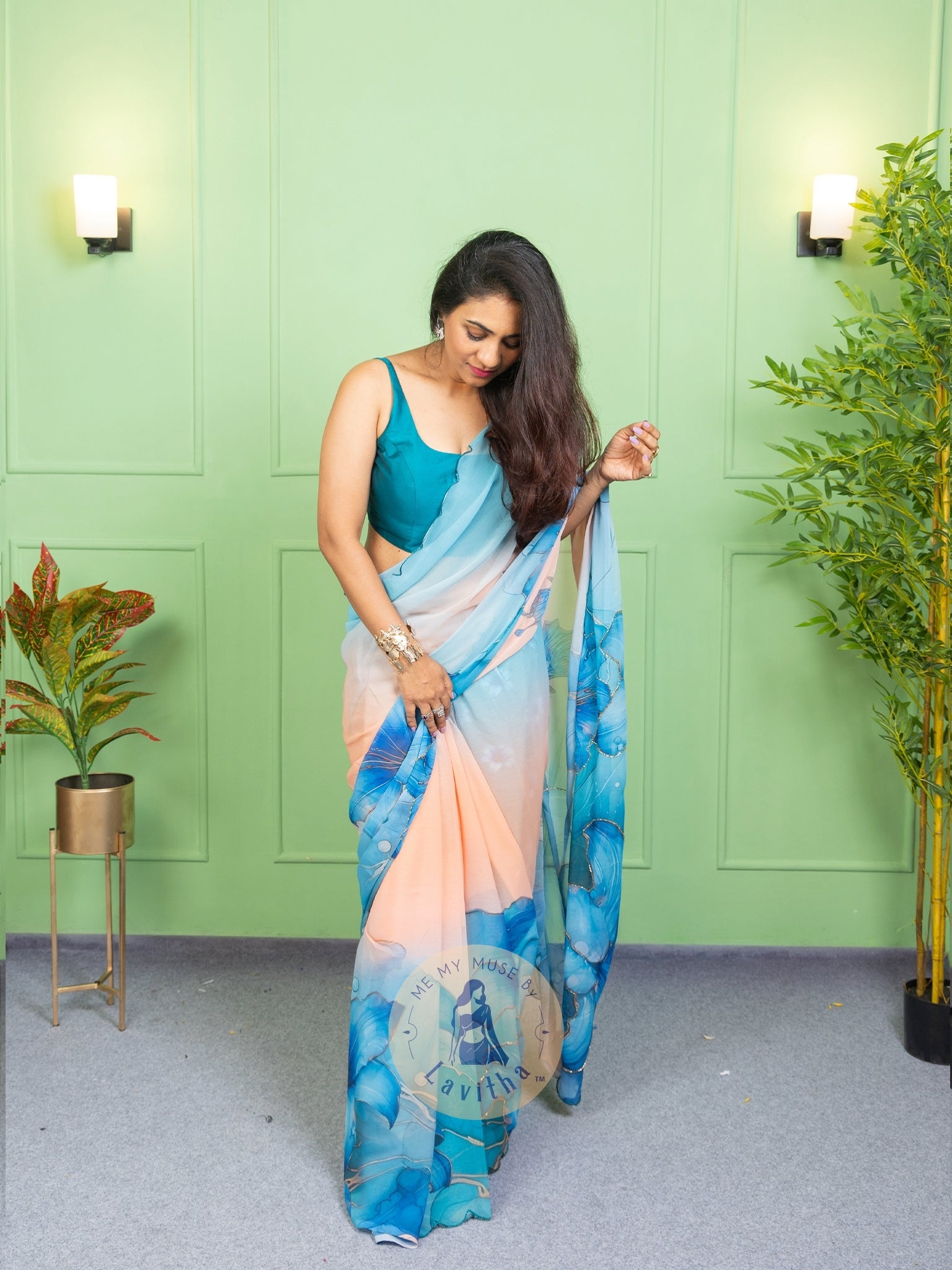Our muse in a bollywood-style glamorous green chiffon saree with floral katdana work with ready-to-wear Rama Green brocade blouse perfect for parties and dinner dates exclusively from Me My Muse by Lavitha