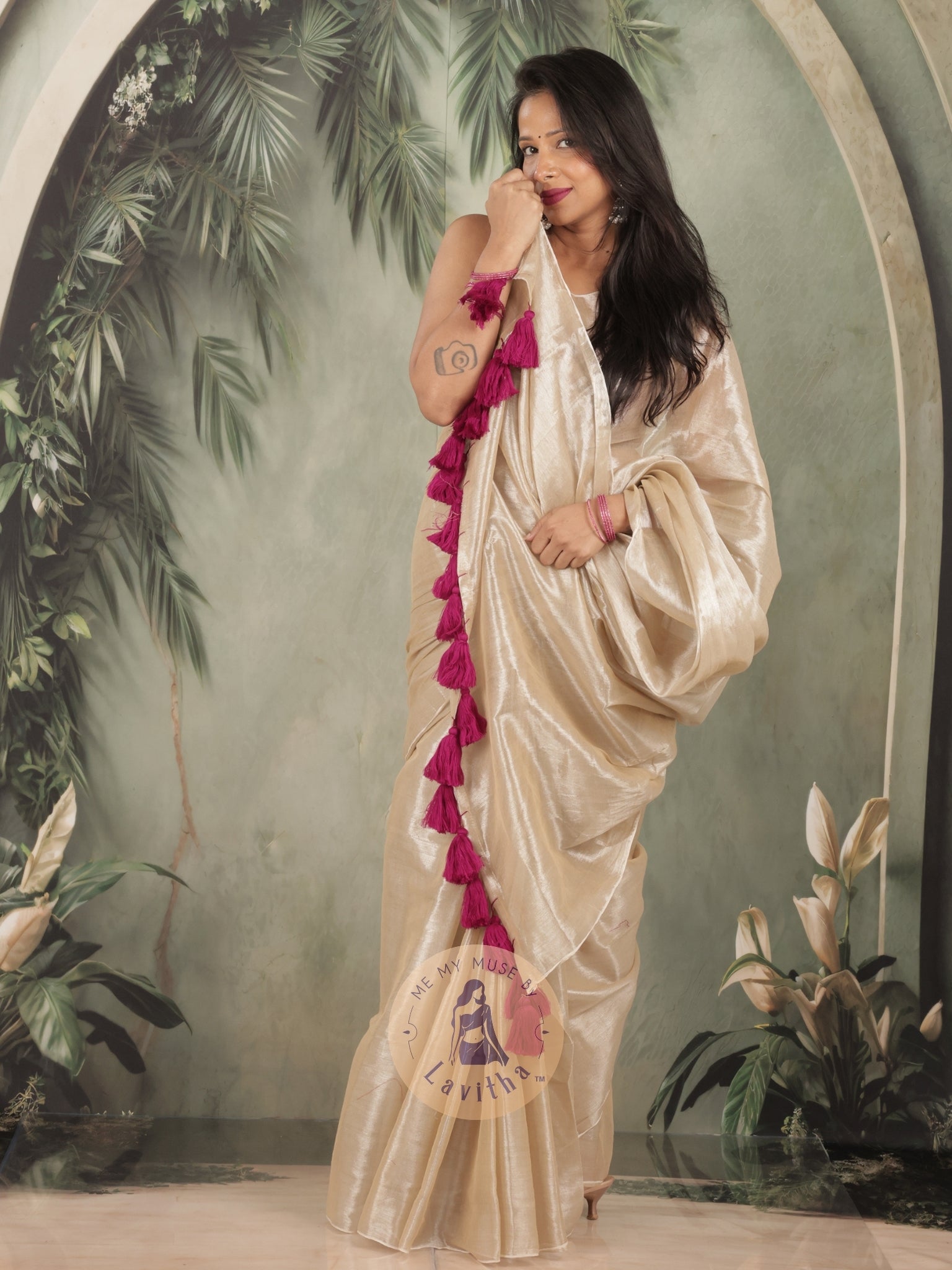 Bombshell Creamy Gold Tissue Saree with Purple Tassels