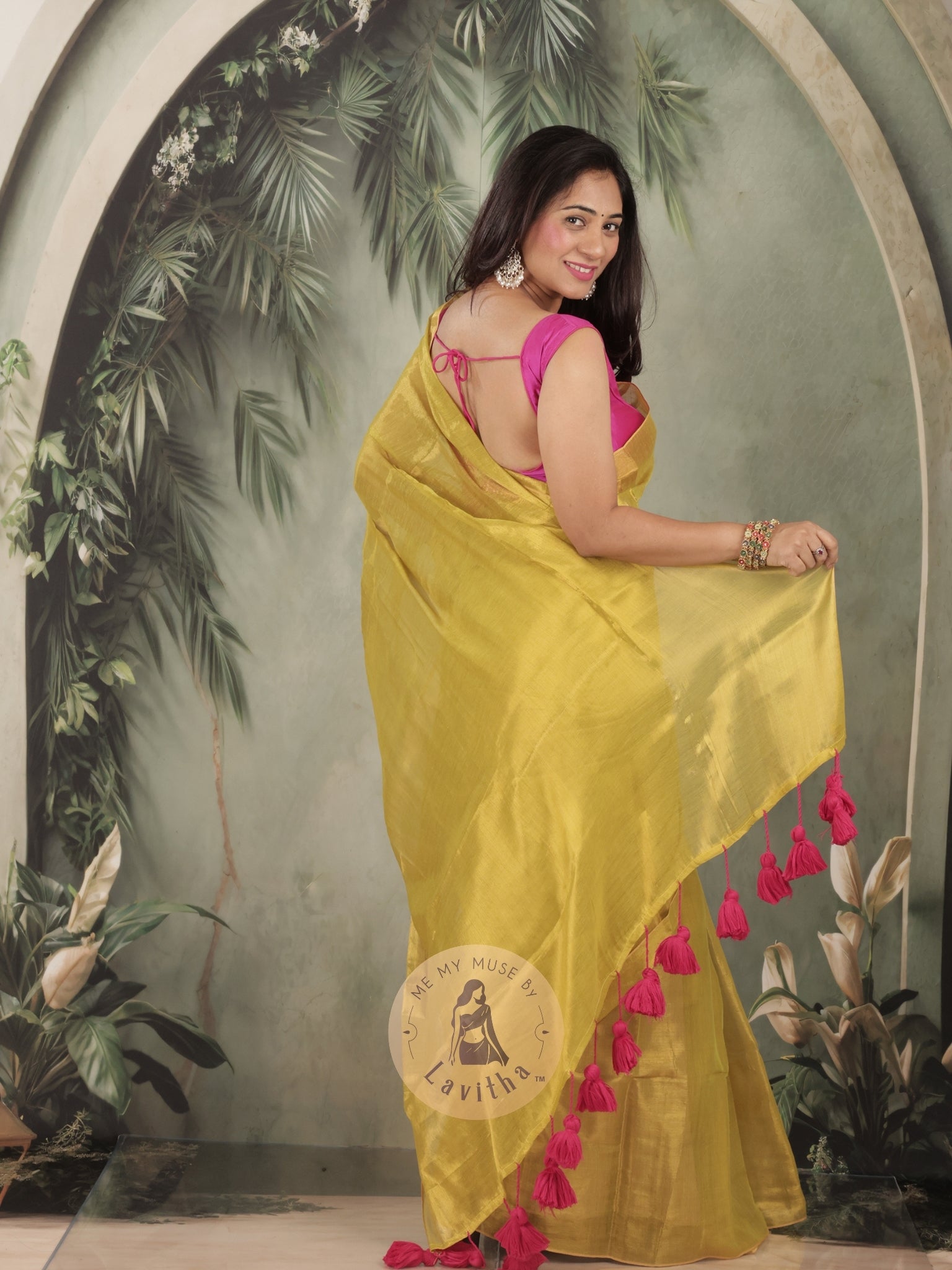 Bombshell Sunny Green Tissue Saree with Fuschia Pink Tassels