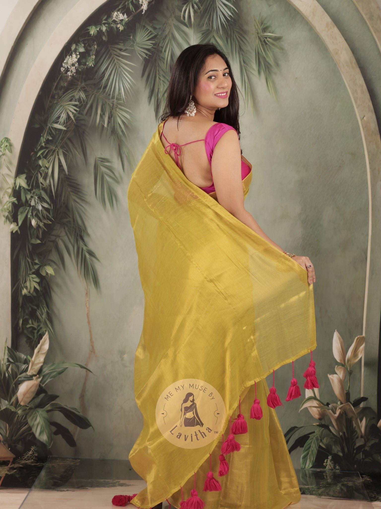 Bombshell Sunny Green Tissue Saree with Fuschia Pink Tassels