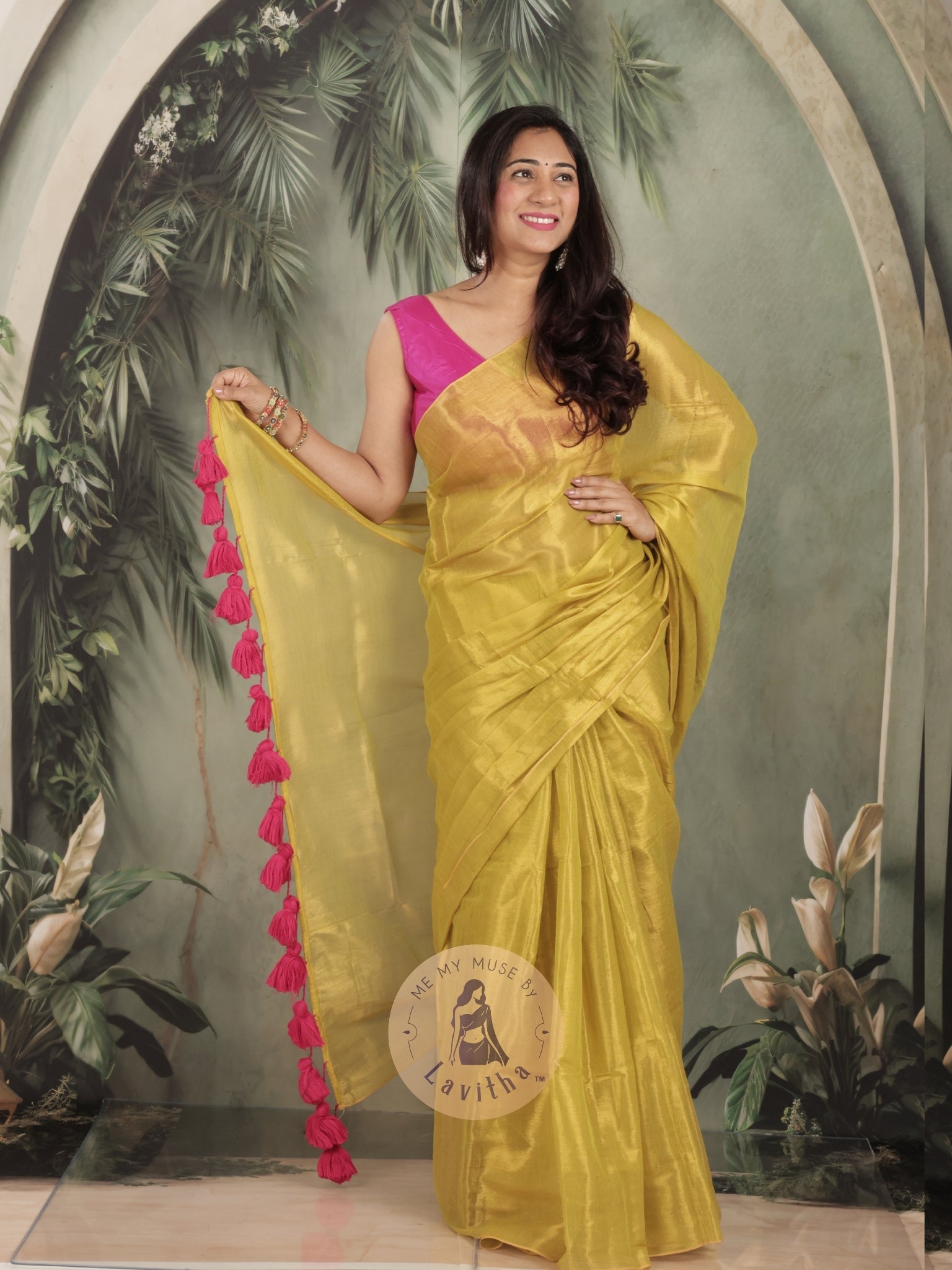 Bombshell Sunny Green Tissue Saree with Fuschia Pink Tassels