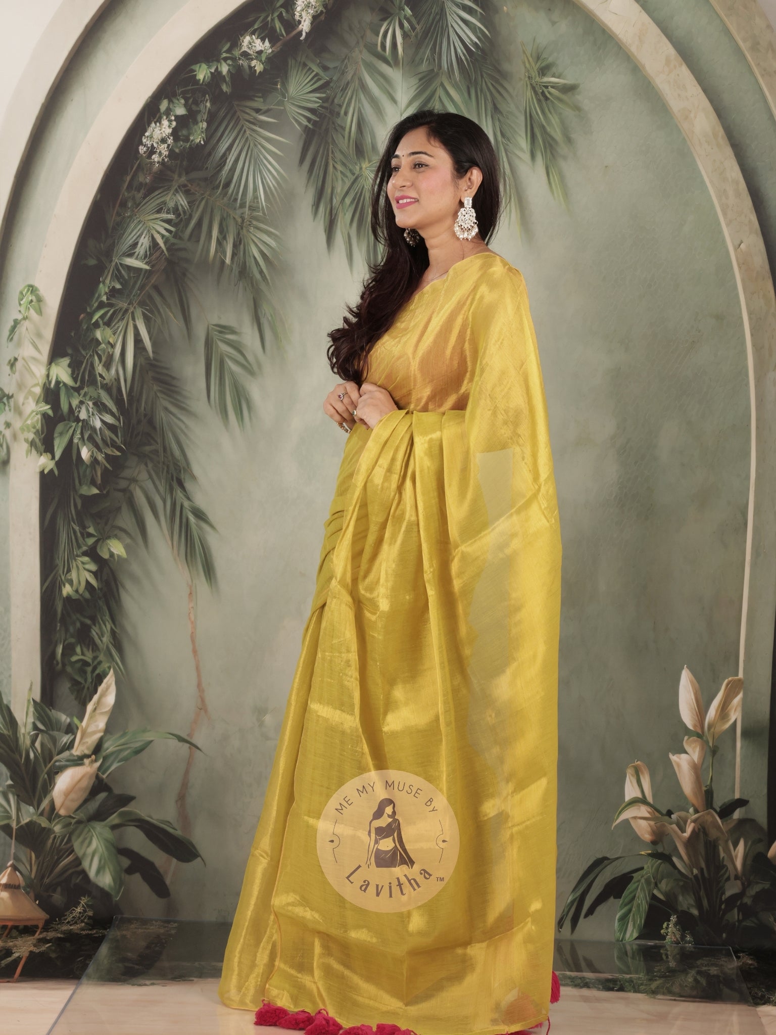 Bombshell Sunny Green Tissue Saree with Fuschia Pink Tassels