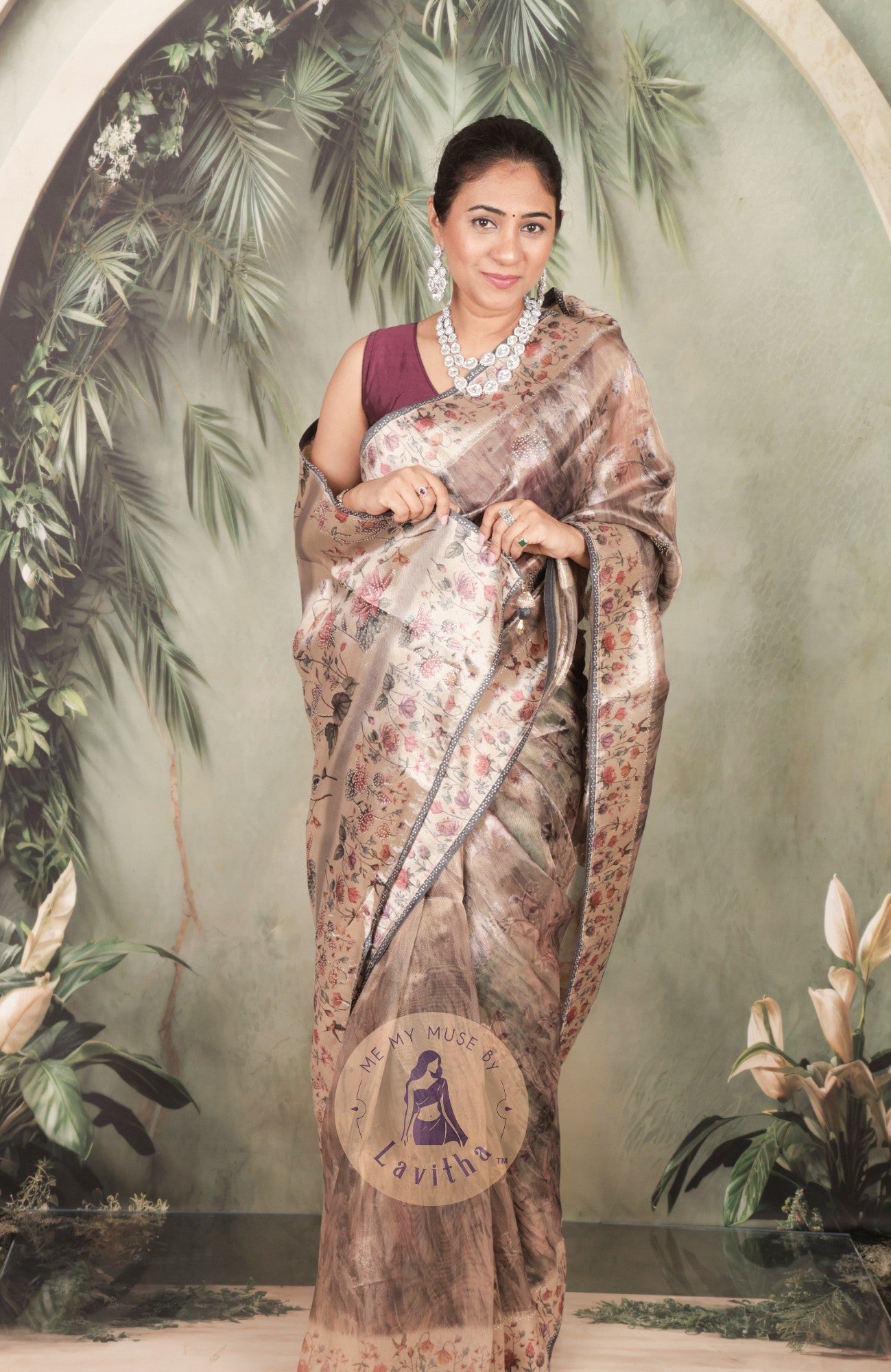 Our muse in a brown grey satin saree with digital floral print design and intricate floral design and crystal work on the border and pallu. This saree is part of the Dilqash collection from Me My Muse by Lavitha