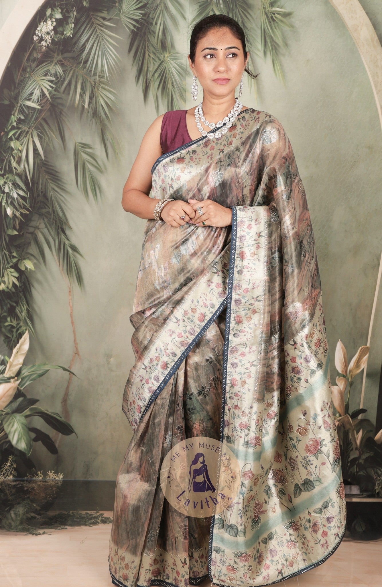 Our muse in a grey green satin saree with digital floral print design and intricate floral design and crystal work on the border and pallu. This saree is part of the Dilqash collection from Me My Muse by Lavitha