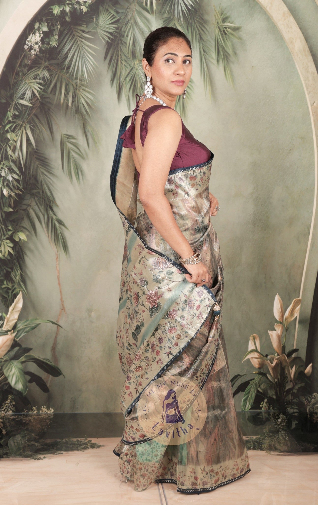 Our muse in a grey green satin saree with digital floral print design and intricate floral design and crystal work on the border and pallu. This saree is part of the Dilqash collection from Me My Muse by Lavitha