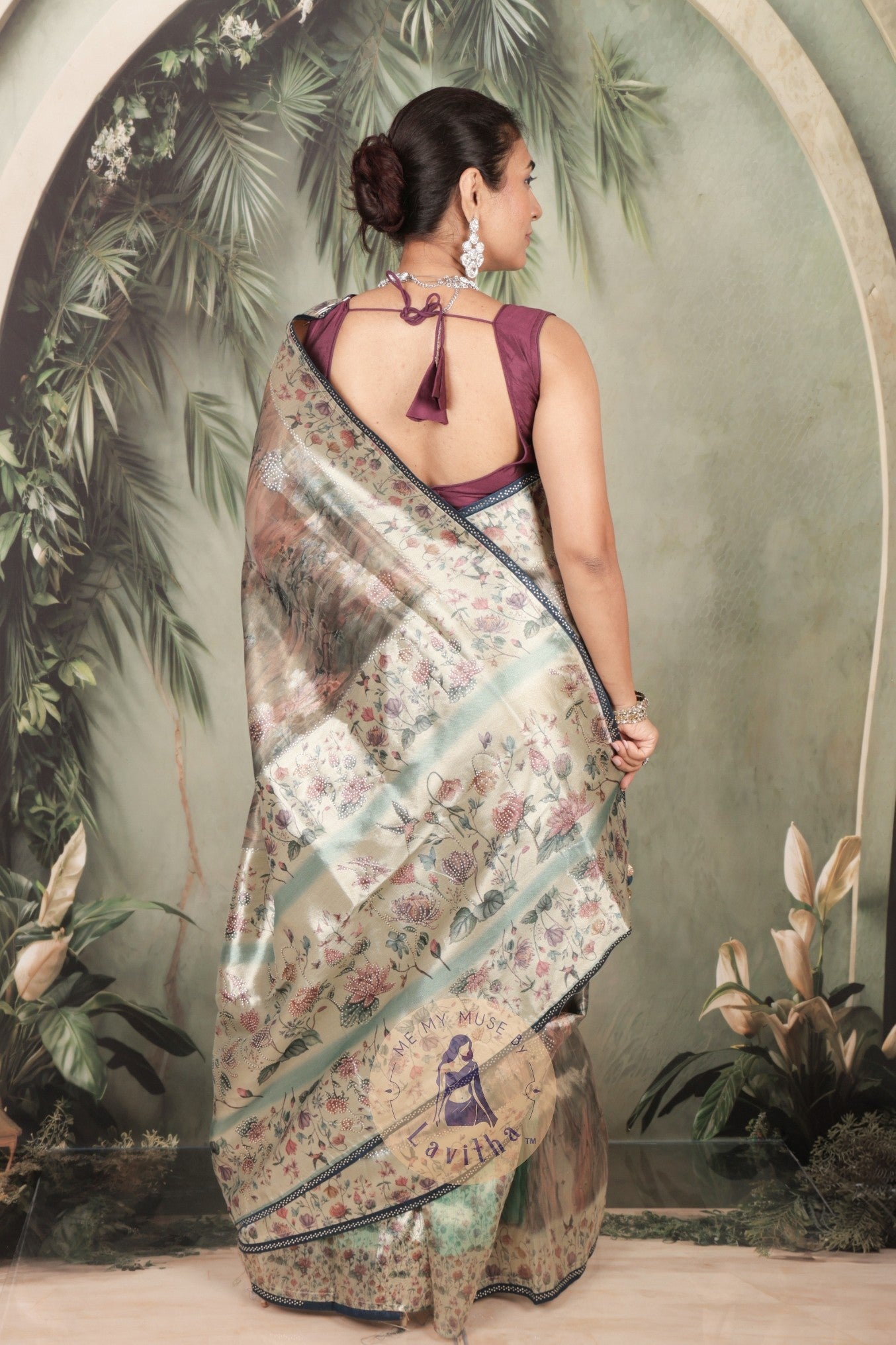 Our muse in a grey green satin saree with digital floral print design and intricate floral design and crystal work on the border and pallu. This saree is part of the Dilqash collection from Me My Muse by Lavitha