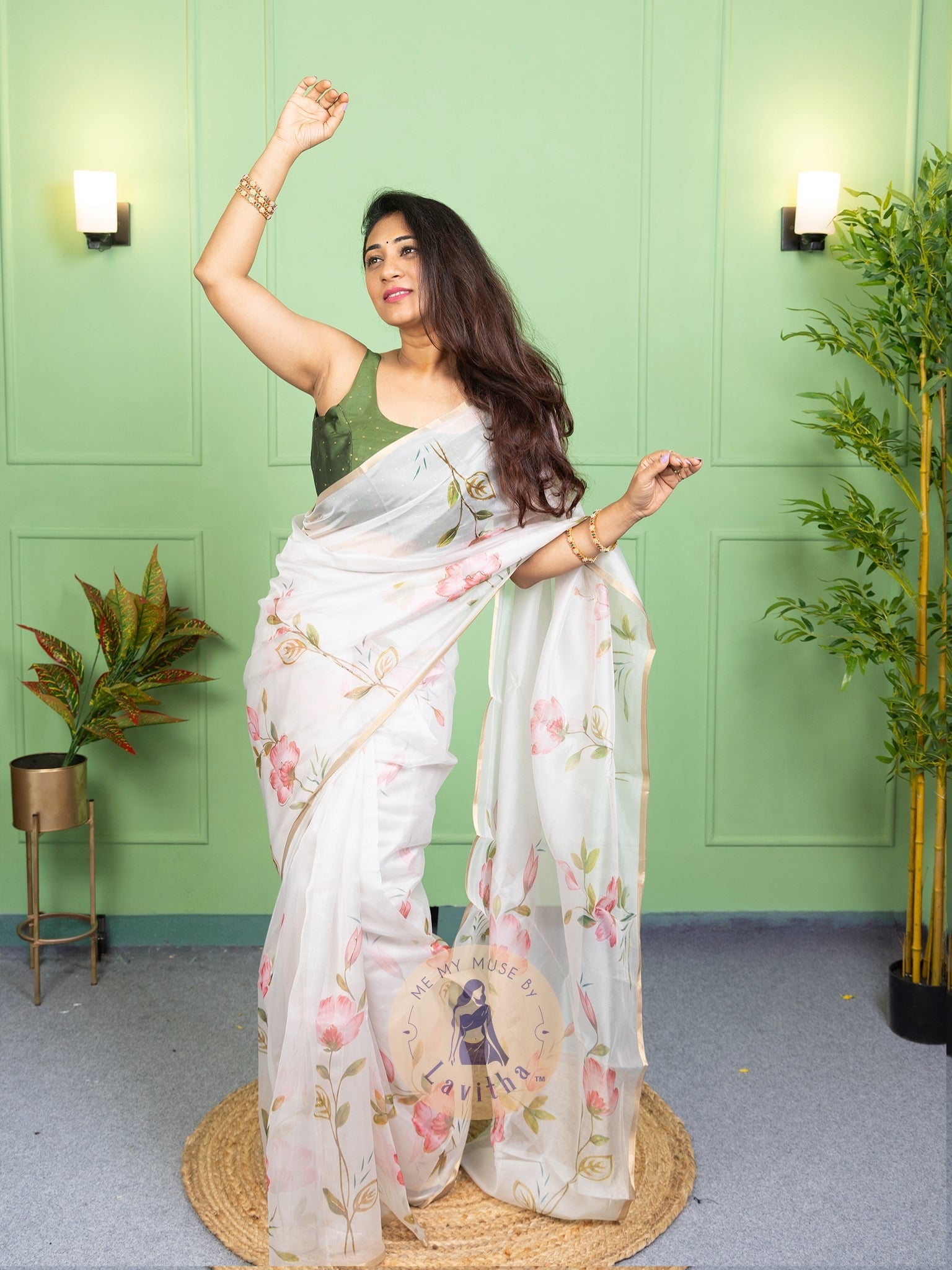 Our muse in a white organza printed saree with floral patterns and thin gold border from Me My Muse by Lavitha