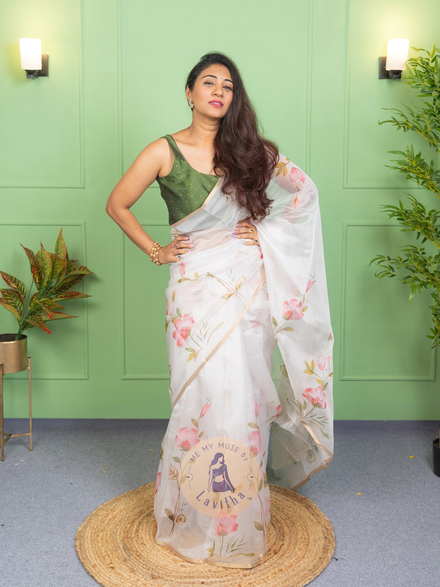 Our muse in a white organza printed saree with floral patterns and thin gold border from Me My Muse by Lavitha