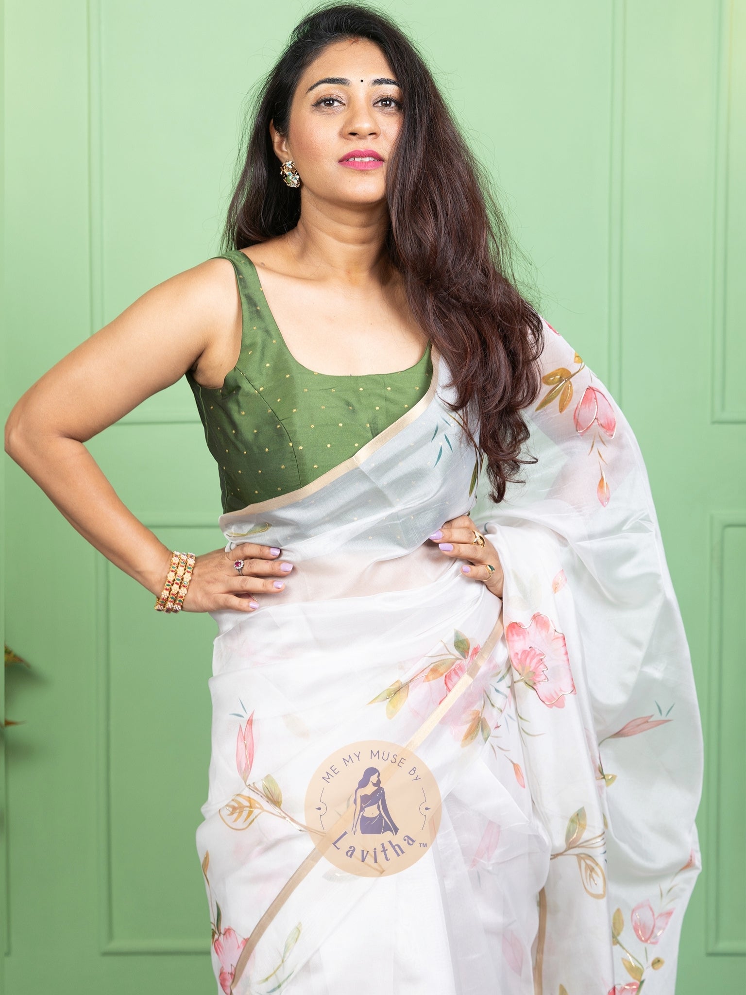 Our muse in a white organza printed saree with floral patterns and thin gold border from Me My Muse by Lavitha