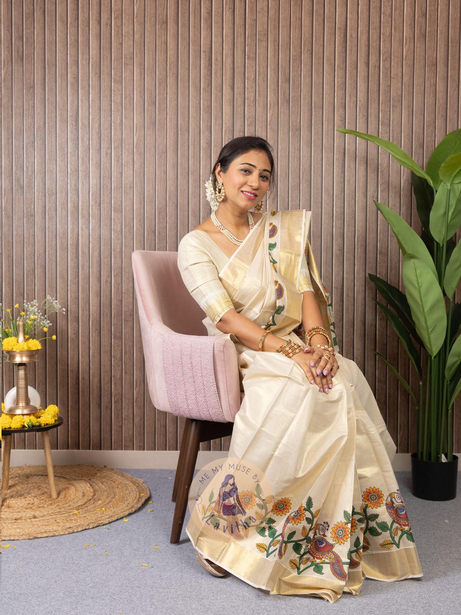 Our muse in a cream and gold Kerala Kasavu Tissue Silk saree with peacock and floral prints exclusively available on Me My Muse by Lavitha