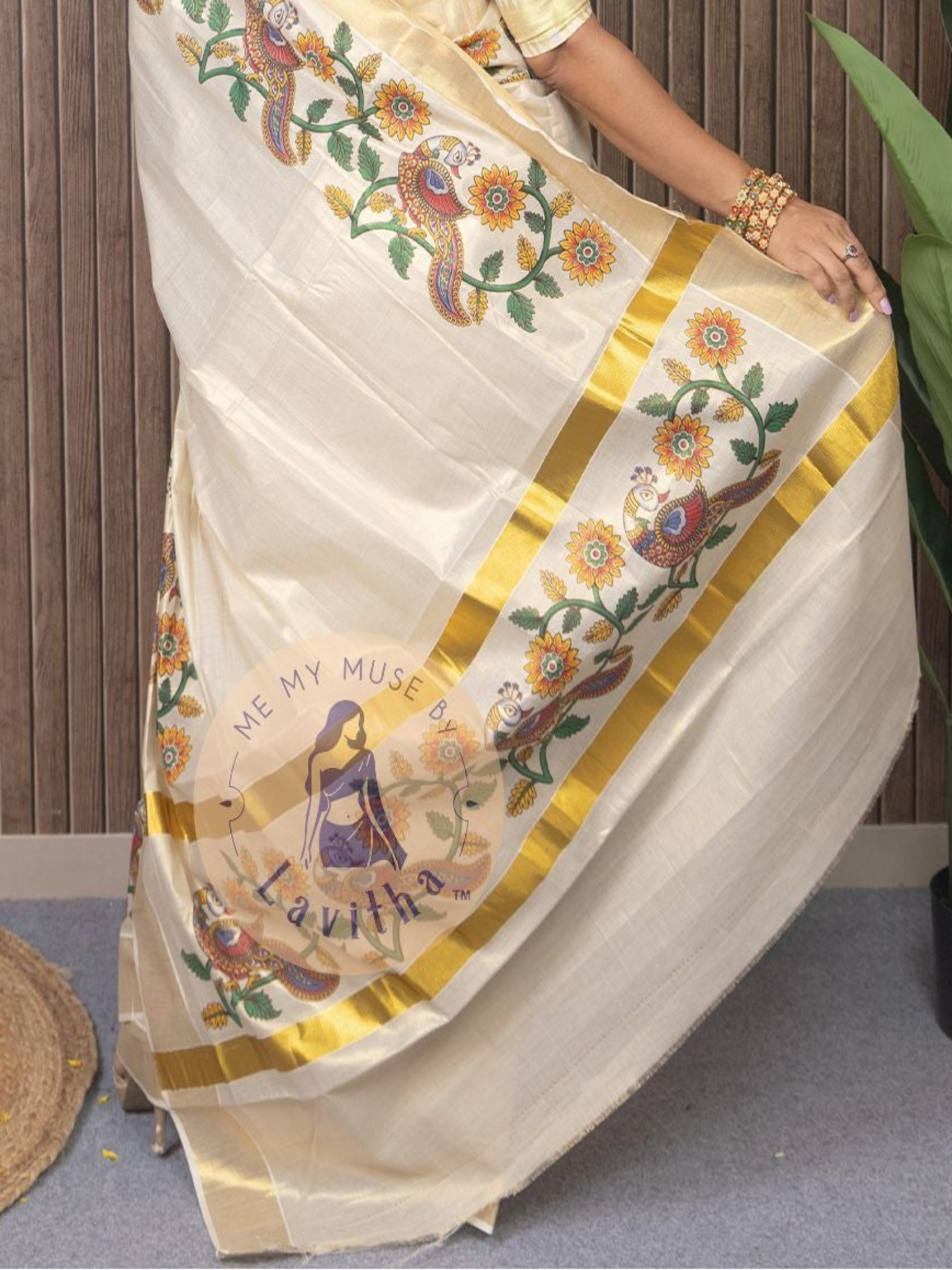 Our muse in a cream and gold Kerala Kasavu Tissue Silk saree with peacock and floral prints exclusively available on Me My Muse by Lavitha